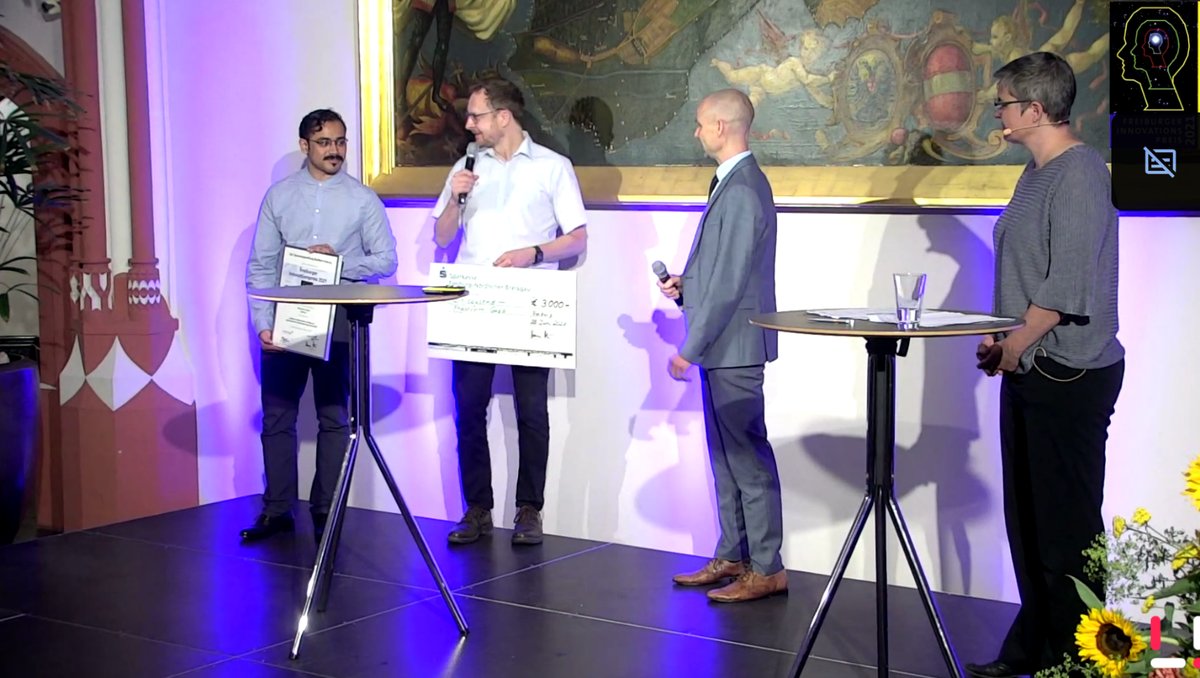 The Phaseform team on stage at the Freiburger Innovationspreis ceremony, holding the certificate and the prize cheque.